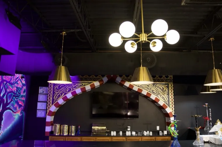 The bar beneath warm pendant lights