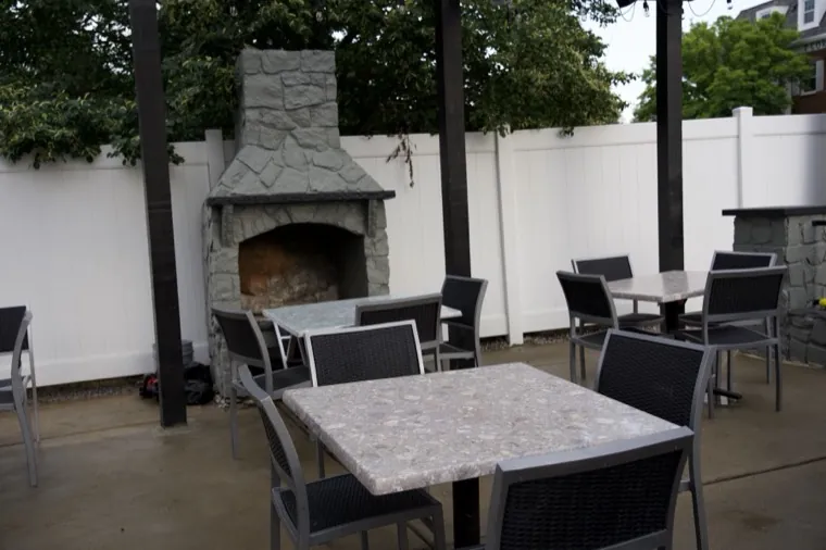 Outdoor patio seating beside the fireplace